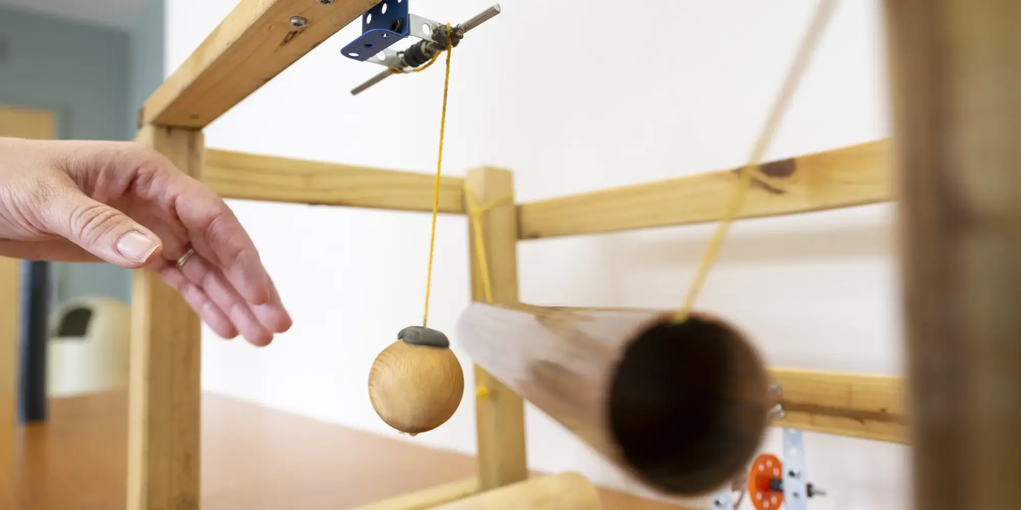 a hand with a device making Foley effects