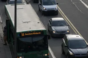 a bus and cars on a Pittsburgh road