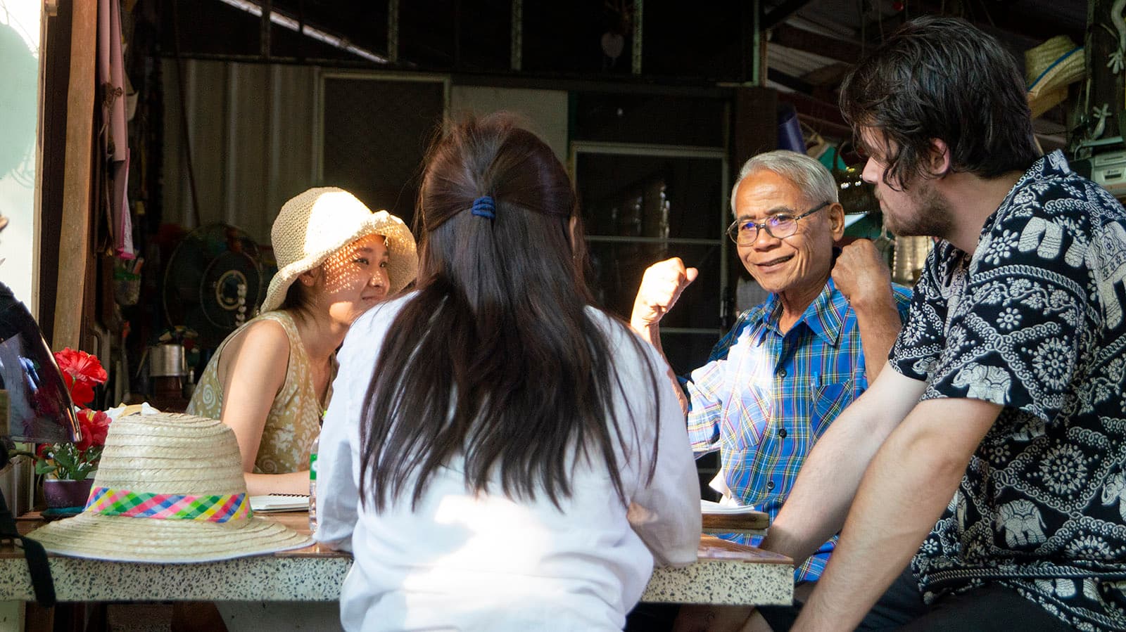 Students listen intently as Phaw Pheeyin shares stories about his daily routines and his family's compound. (Tommy Yang, January 2020)