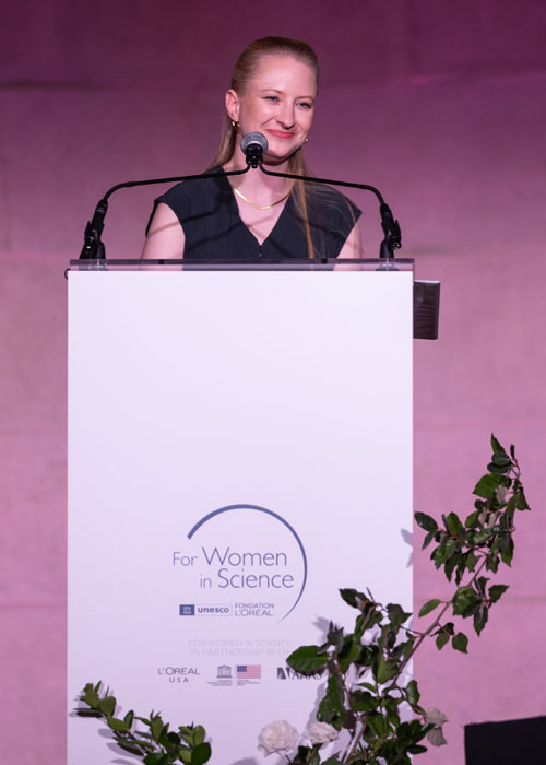 Taylor at podium at For Women in Science