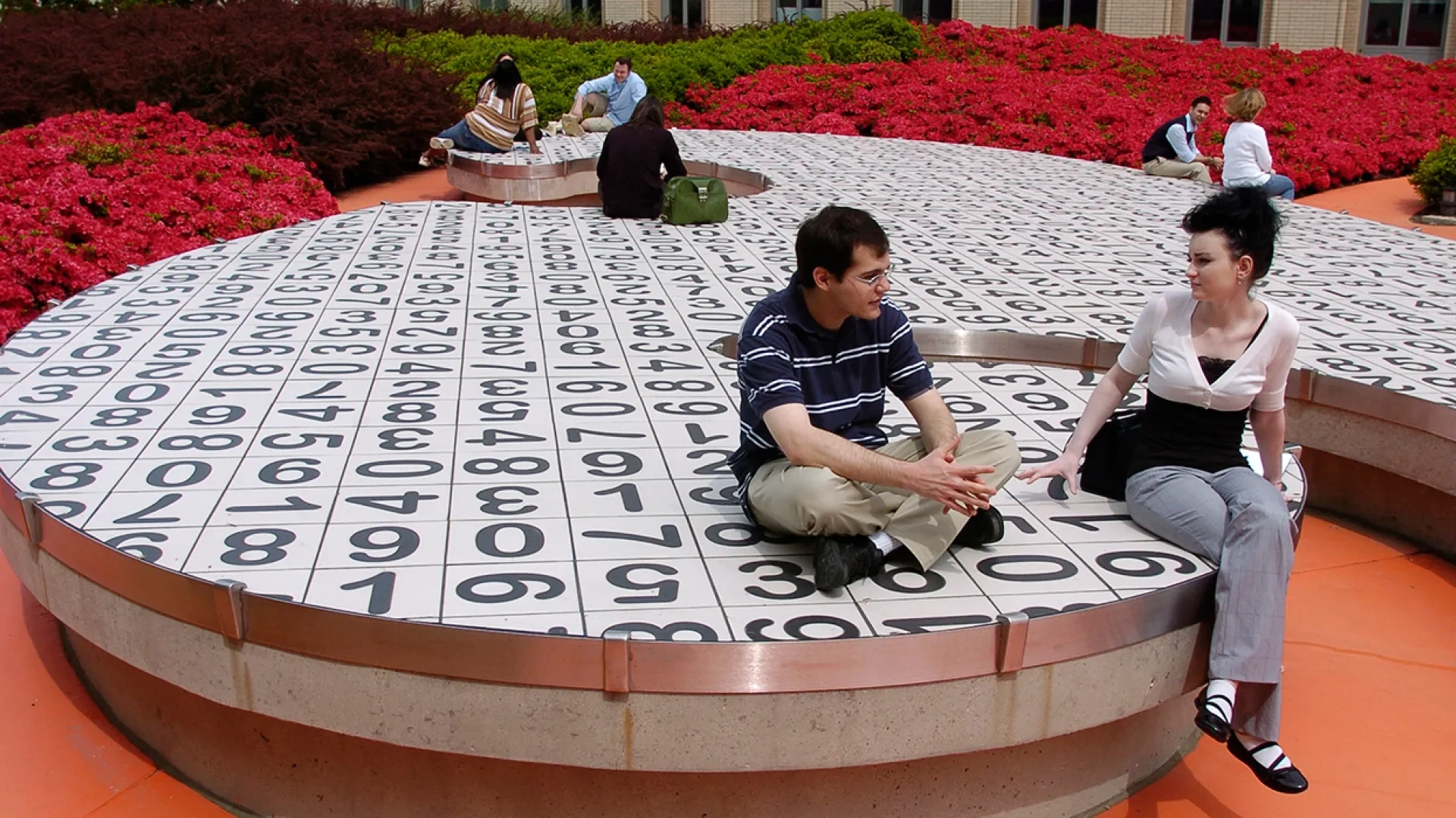 CMU students sitting on an interactive art installation
