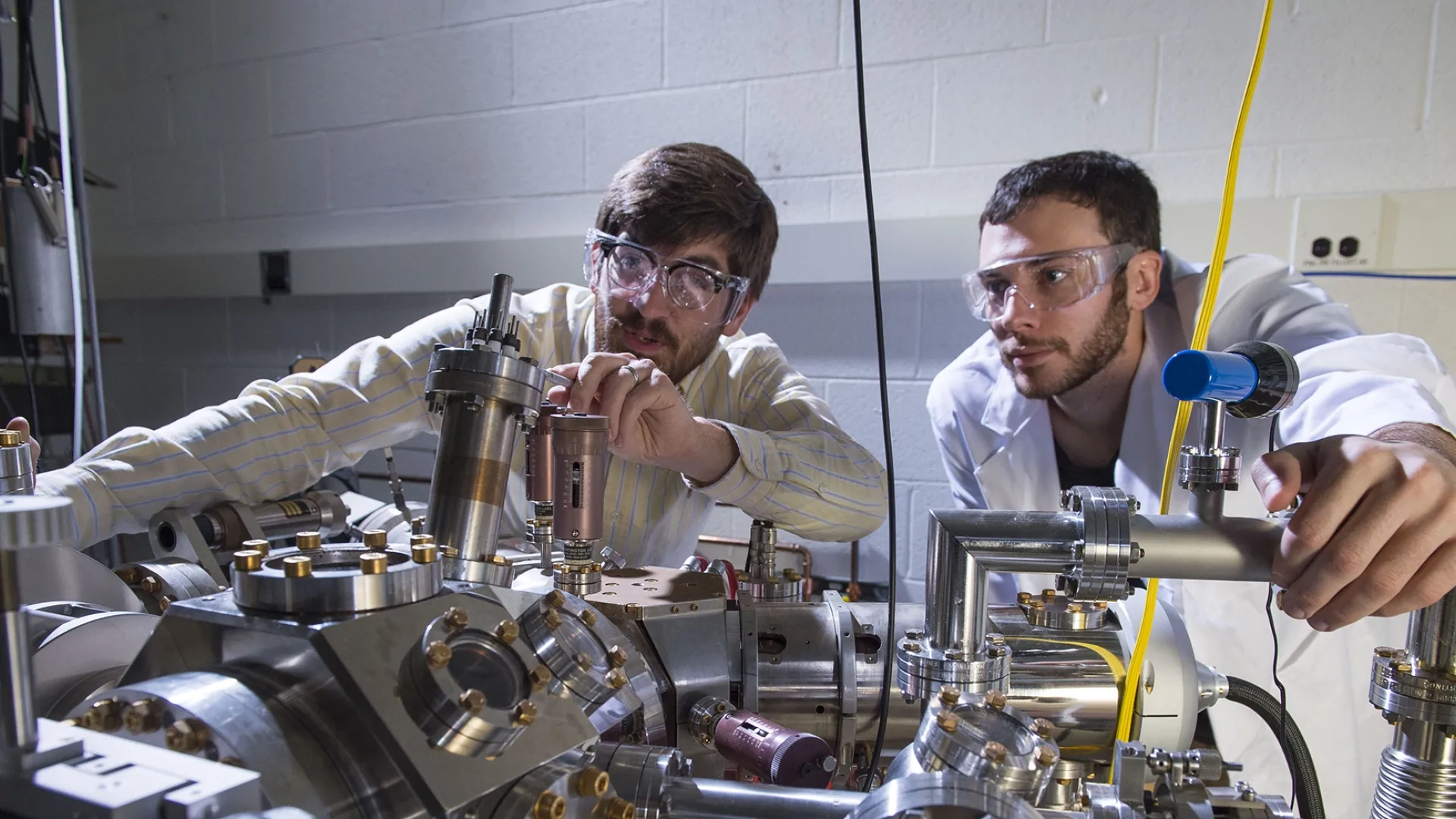 Two students collaborate in a lab. 