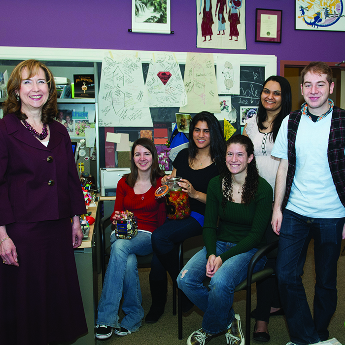 Karen Stump in her office with students.