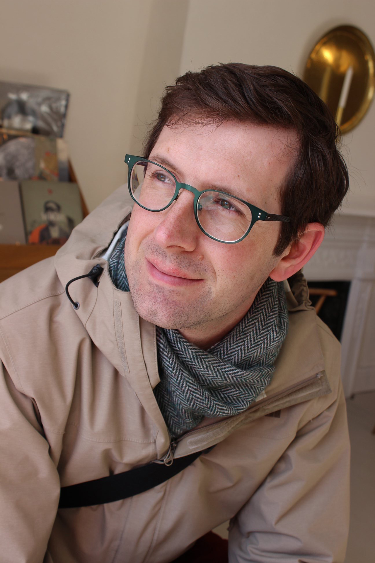 Mike Bueti sits and smiles.