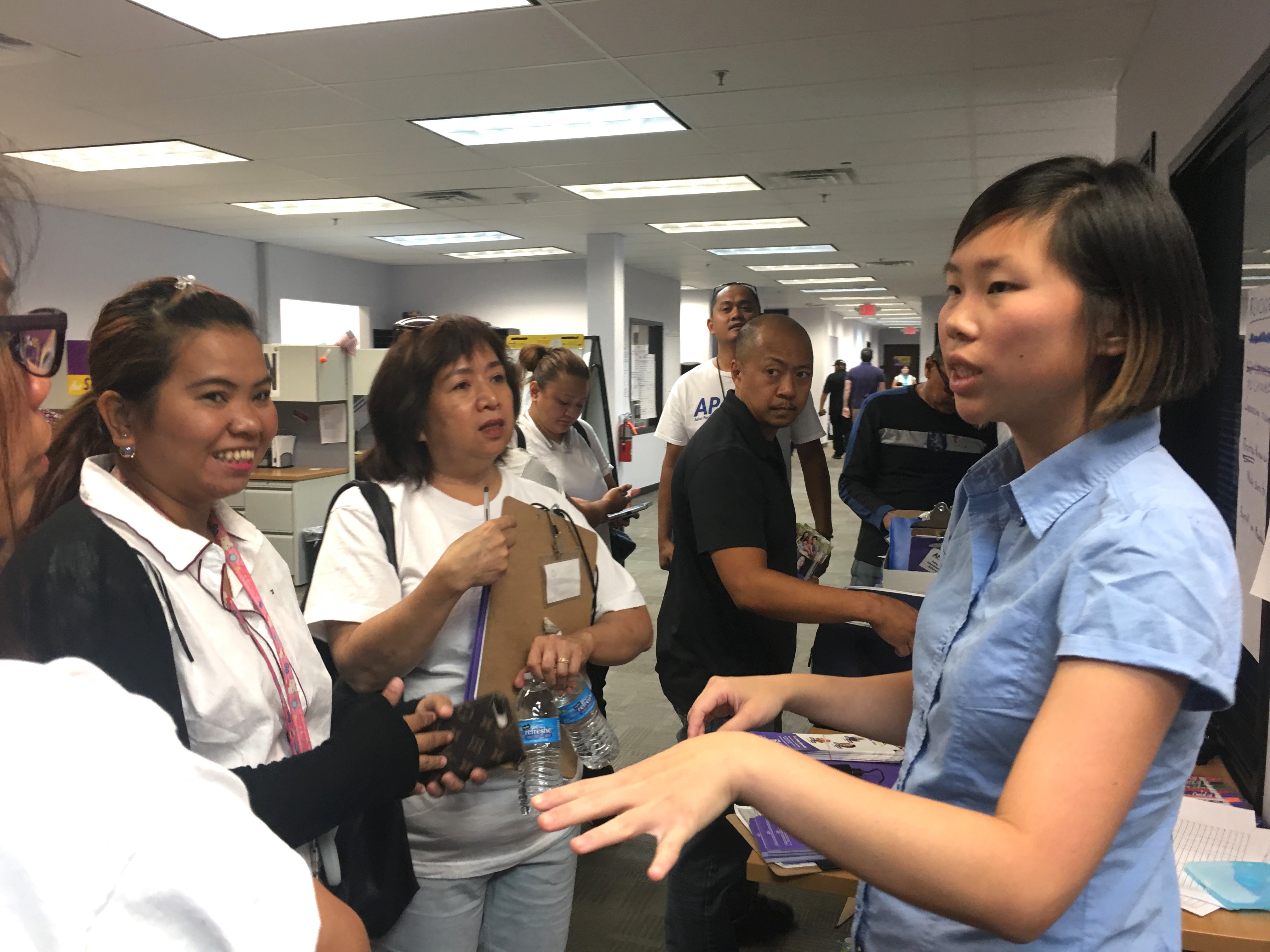 Vivian Chang talks to people as part of the APALA.