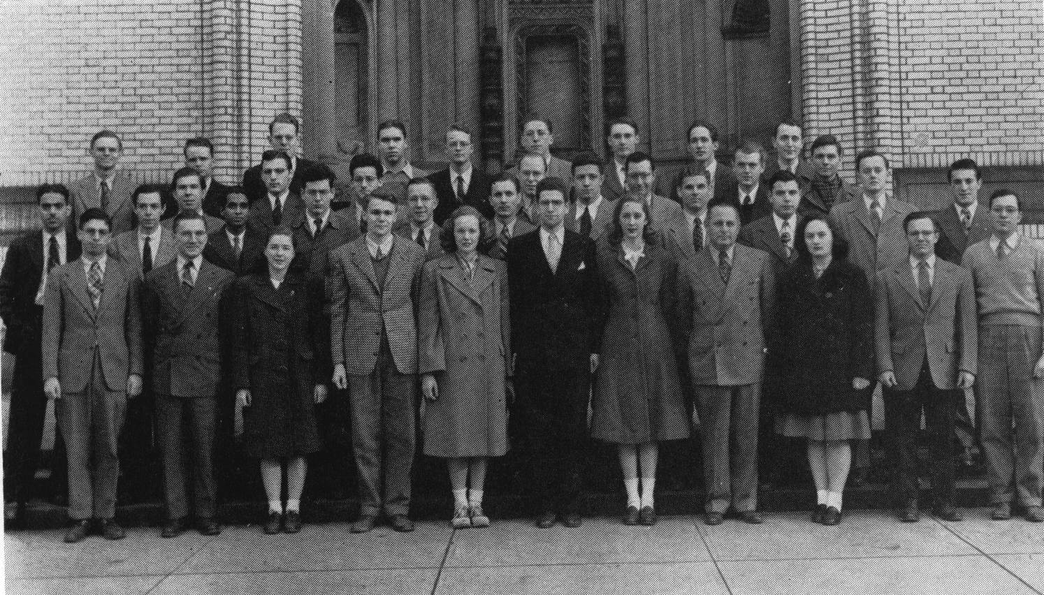 A group photo of Carnegie Tech students standing outside of a building. John Nash is part of the photo.