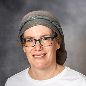 Rachel Mandelbaum smiles at the camera.