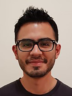 Erick Arguello Cruz smiles at the camera.