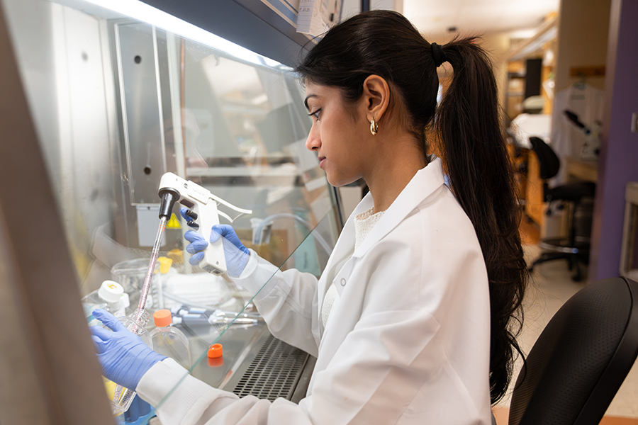 Shreeya Mehta works with laboratory equipment in a chemistry research lab.