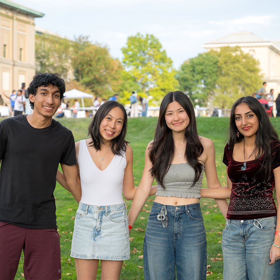 Four smiling students posing for a photo.