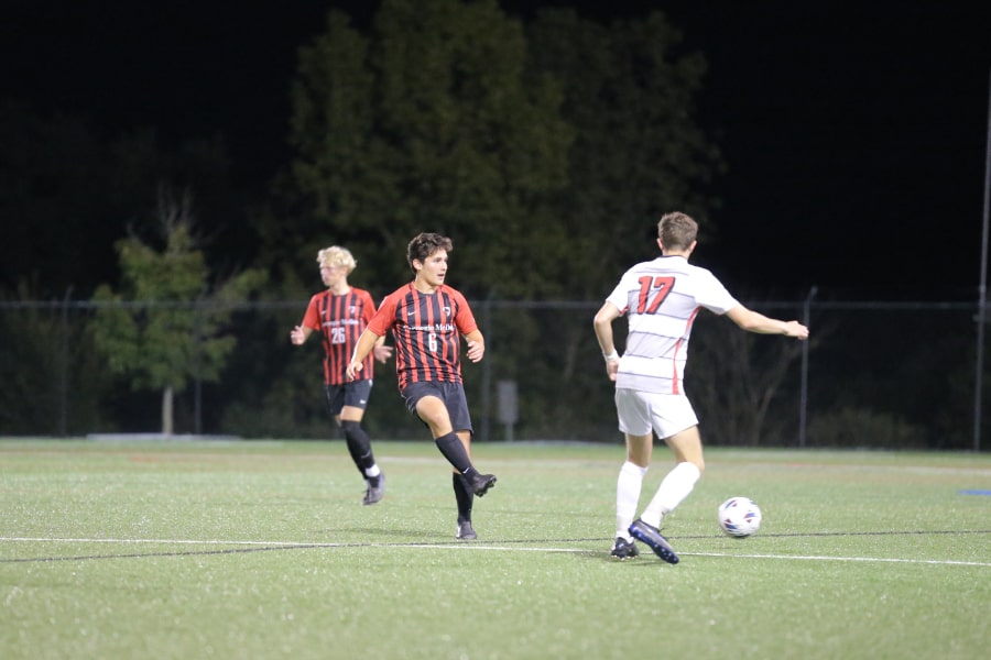 William Rabon (middle) on the pitch at Washington and Jefferson College.