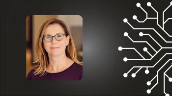 Headshot of smiling Amy Bastian on a black background.