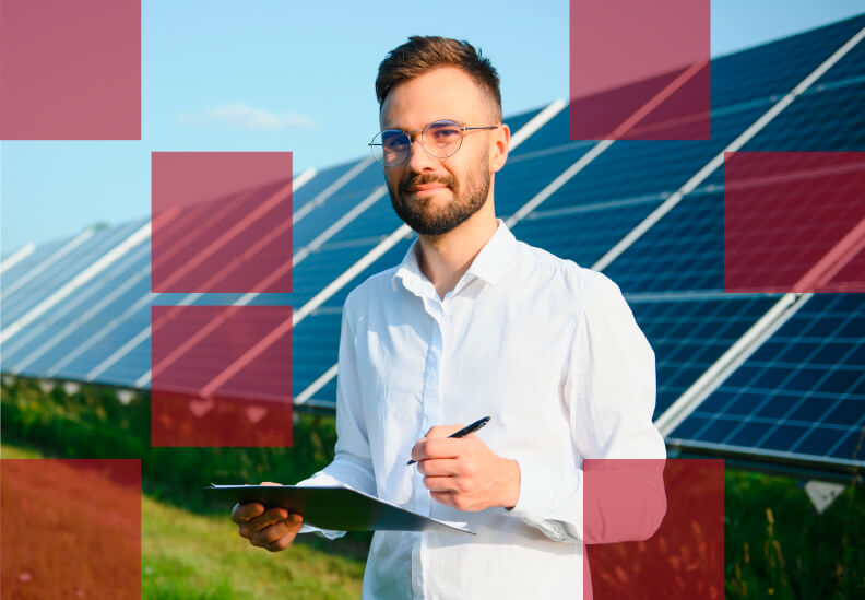 A man in front of solar panels