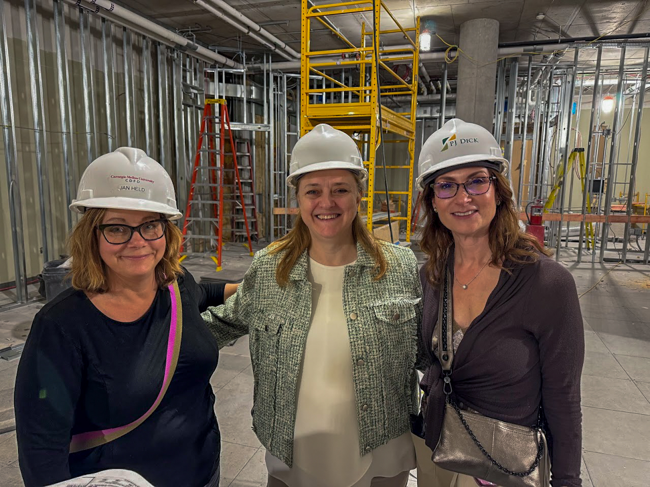 Dean Isabelle Bajeux walks through construction