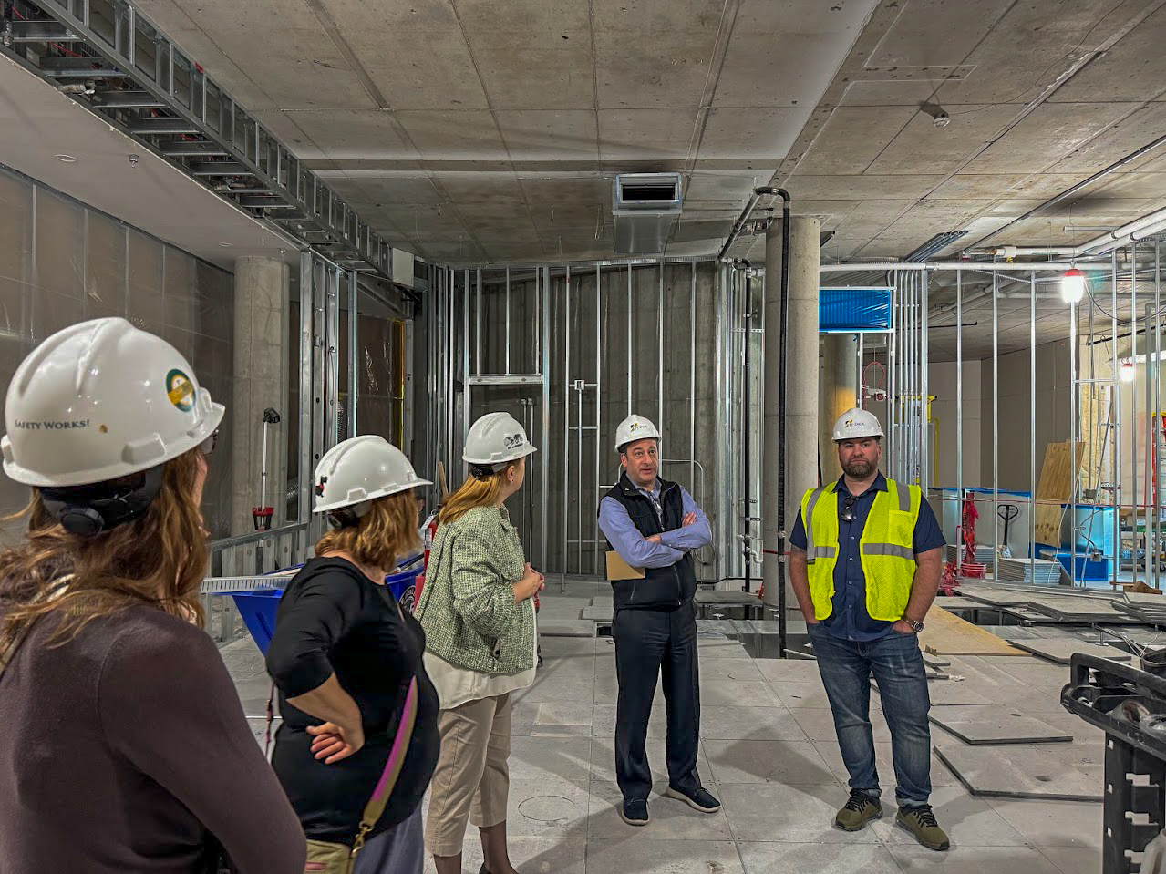 Dean Isabelle Bajeux walks through construction