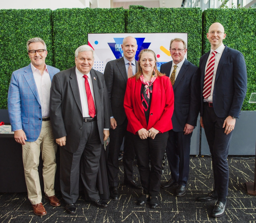 The alumni award winners standing in a group smiling