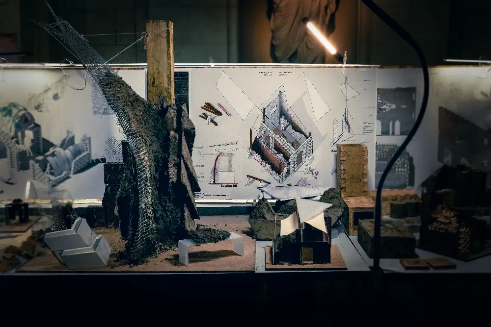 table-top exhibit with display boards and conceptual mockups of building forms.