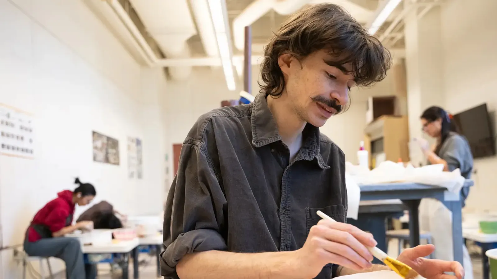 Students create bowls at the School of Art ceramic studio.