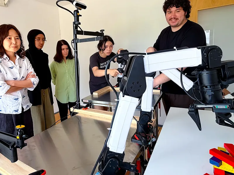 Researchers set up and operate robotic arms using RIO’s unified interface for robot control and teleoperation.
