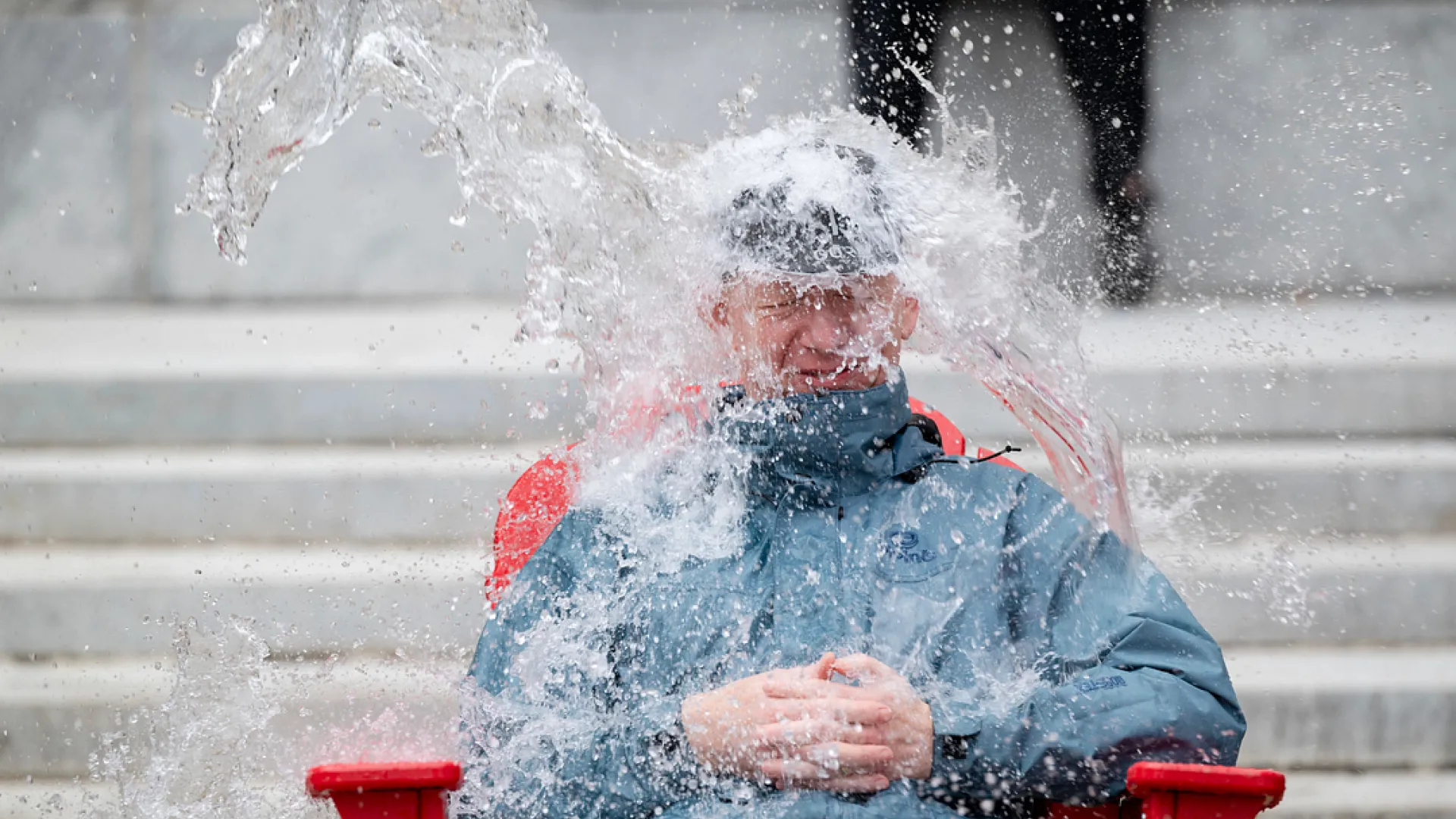 Someone being doused by water at the douse-a-dean fundraiser