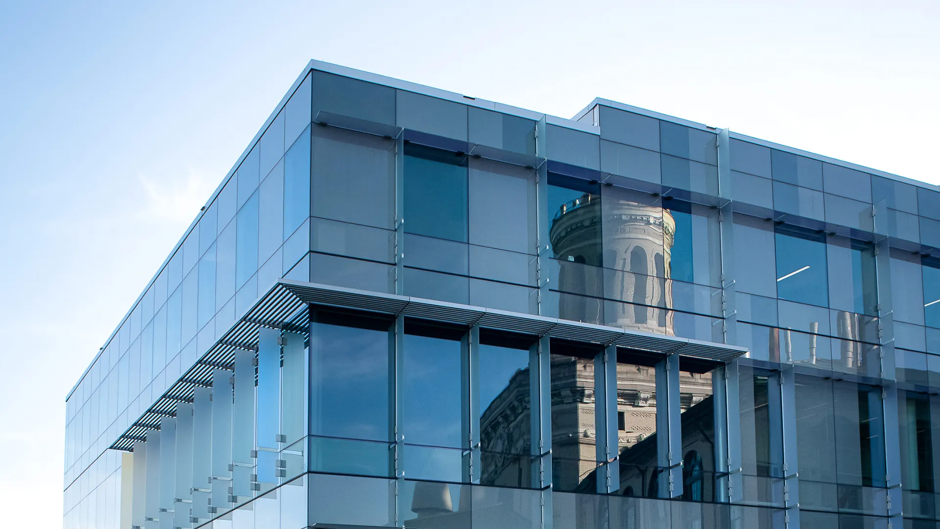 outside of a building with reflections in the windows