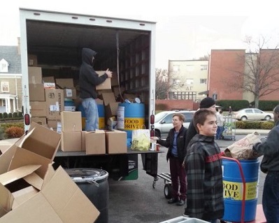 students loading a truck during the Food Drive