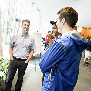 Ken Koedinger with students at the LearnLab presentations