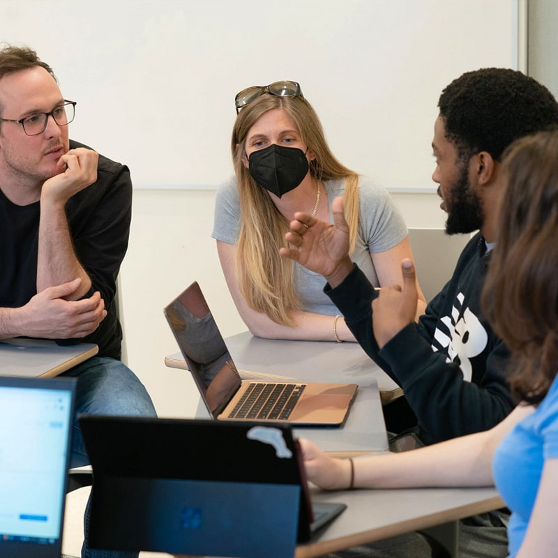 CMU students engage in meaningful discussion in their classroom.