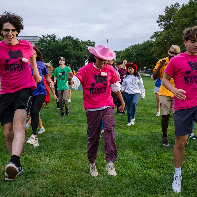 Head Orientation Counselors lead students in a dance on the Cut for First-Year Orientation