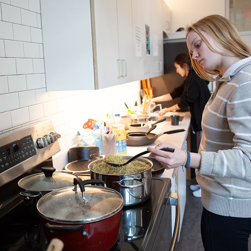 Student cooks in the Fifth and Clyde House community kitchen.