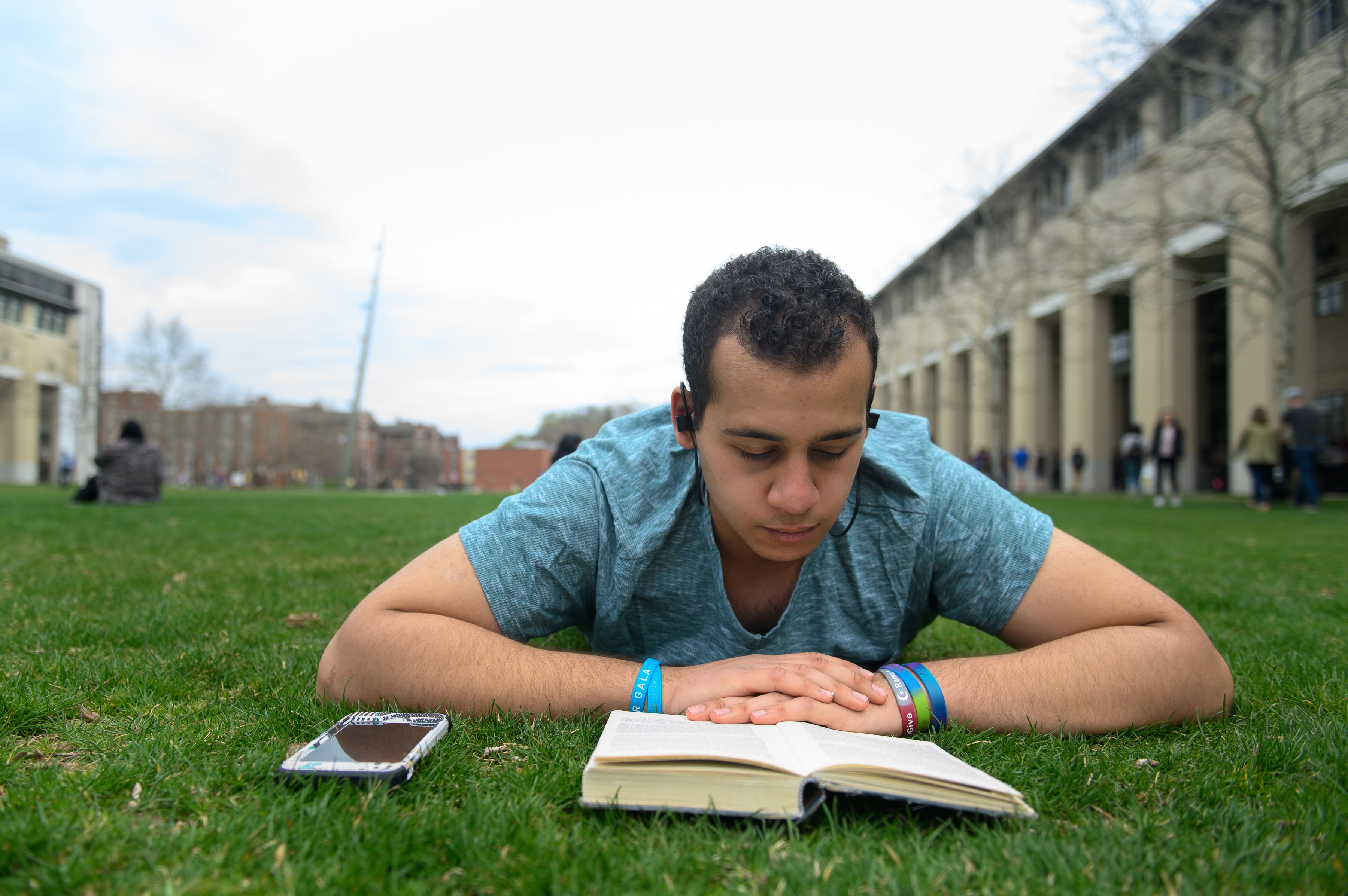 Photo of a student reading a book on the Cut 
