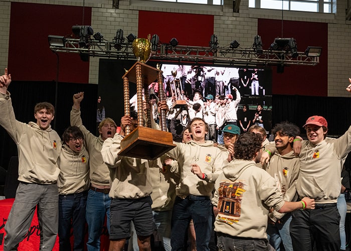 SigEp members cheer as they are awarded the 1st Place trophy for their Indiana Jones Booth at the Carnival Awards Ceremony