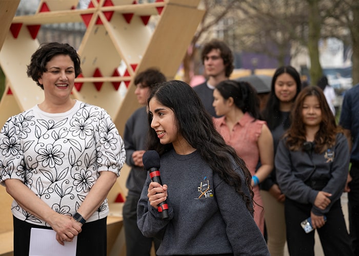 Student speaks at the 2025 Carnival Opening Ceremony in front of Vice President of Student Affairs Gina Casalegno and the CMU and Pittsburgh communities.