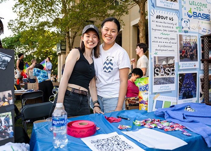 Society of Asian Scientists and Engineers pose for a picture at their table on The Cut during The FAIR.