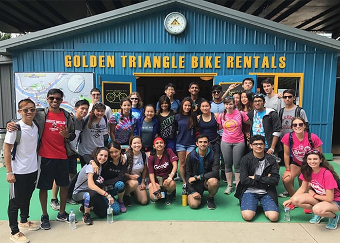 Students pose outside of Golden Triangle Bike Rentals