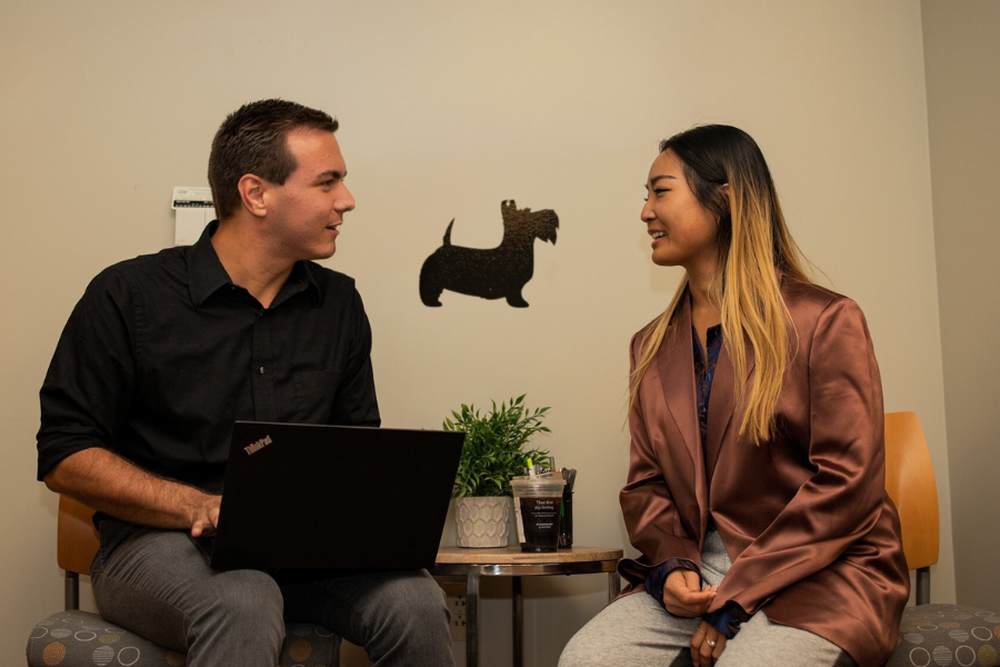a SIT staff member meets with a student in the SIT office