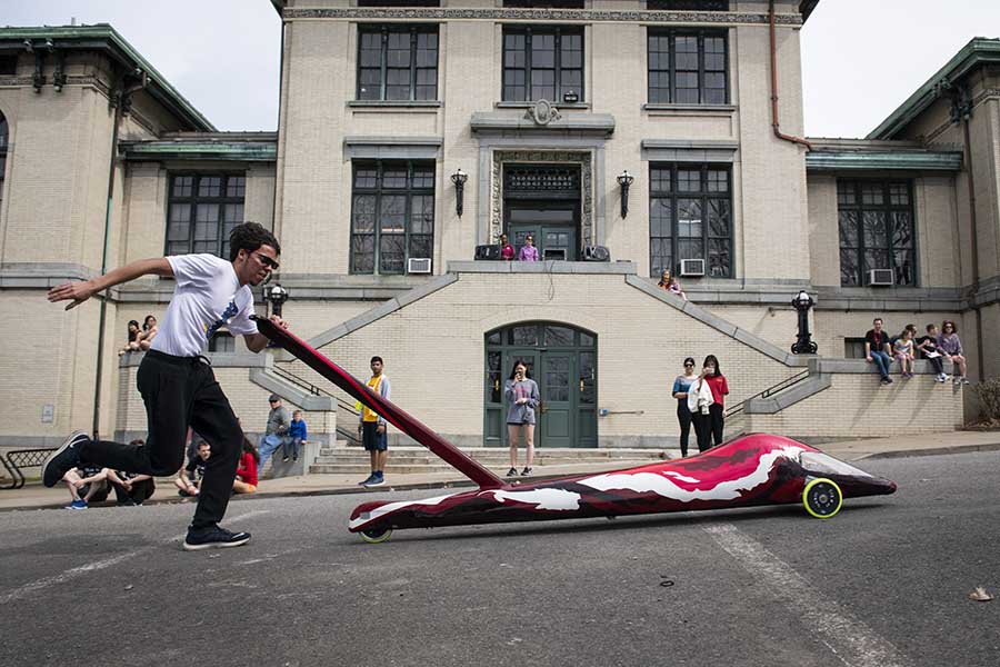 student pushing a buggy