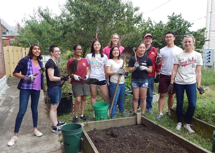 Students working in a garden during a Day of Service