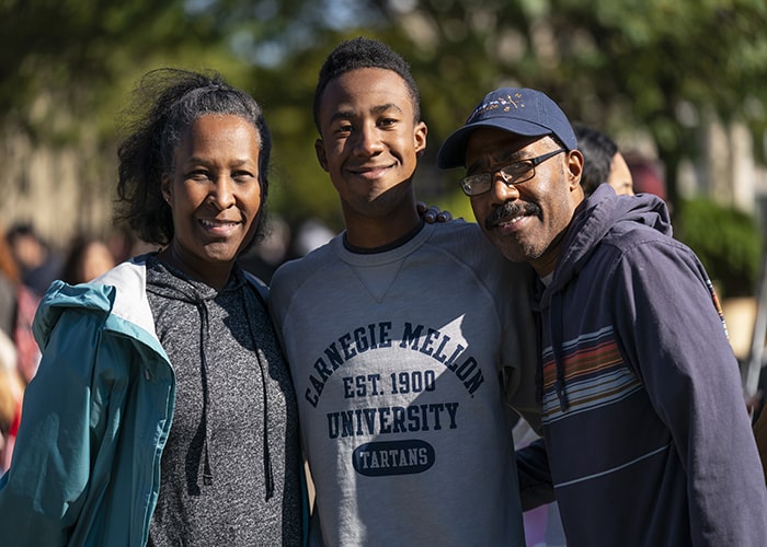 a smiling CMU family