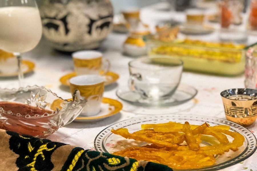 Traditional Afghan meal plated elegantly on a decorated table.