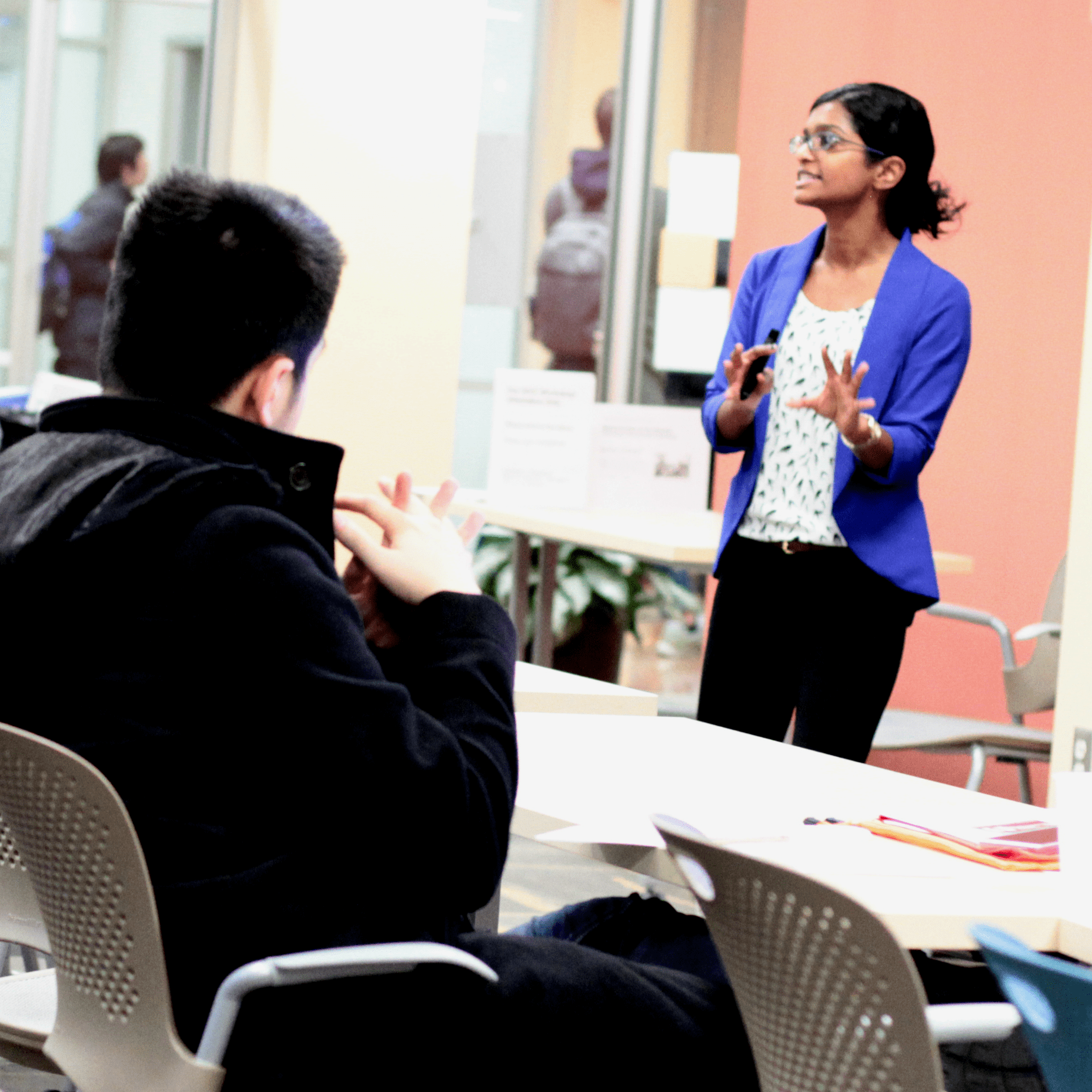 student speaking in front of a room full of peers