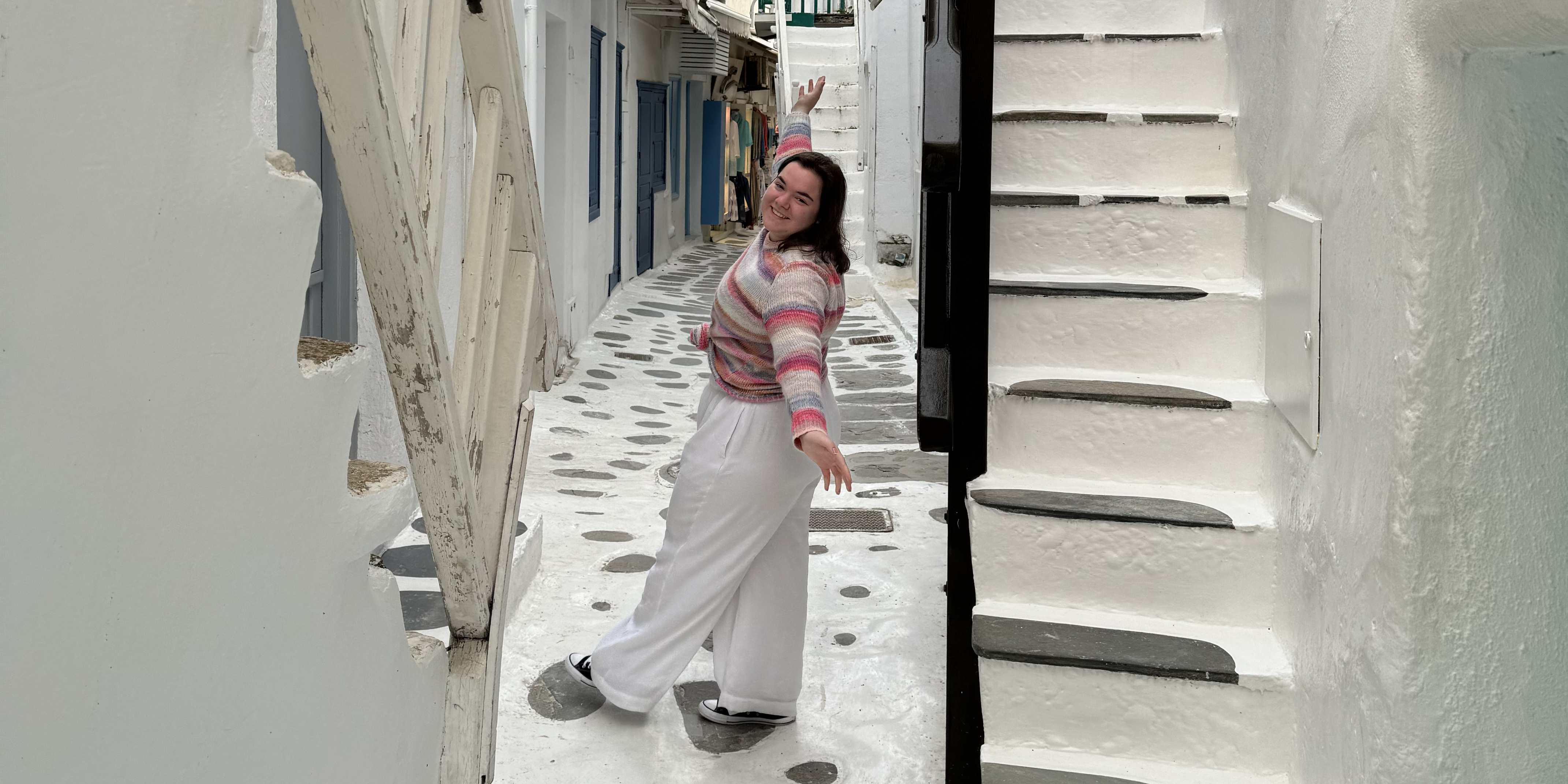 Image of ellie in a scenic white alleyway