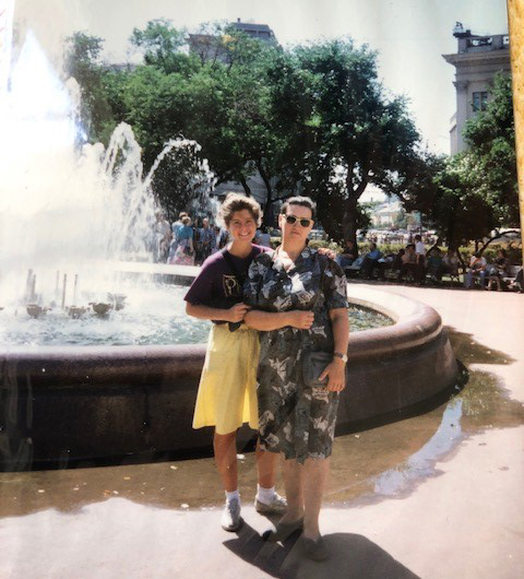 Chris Menand poses with her study abroad host mother, Nadya, in front of a fountain.