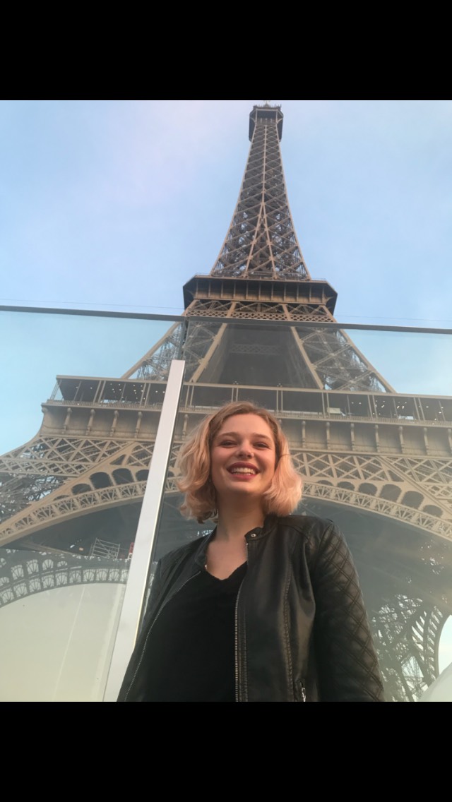 Cate Hayman in front of the Eiffel Tower