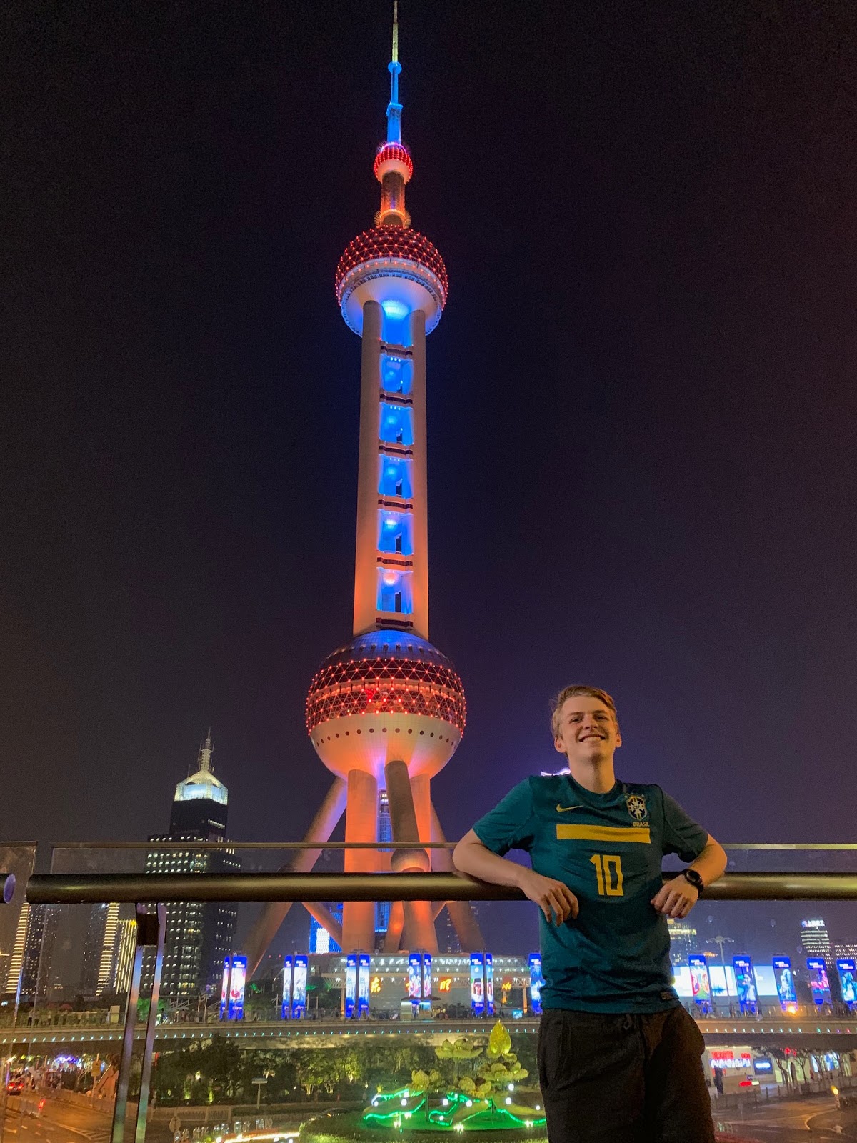 John Martins posing in front of the Pearl TV Tower