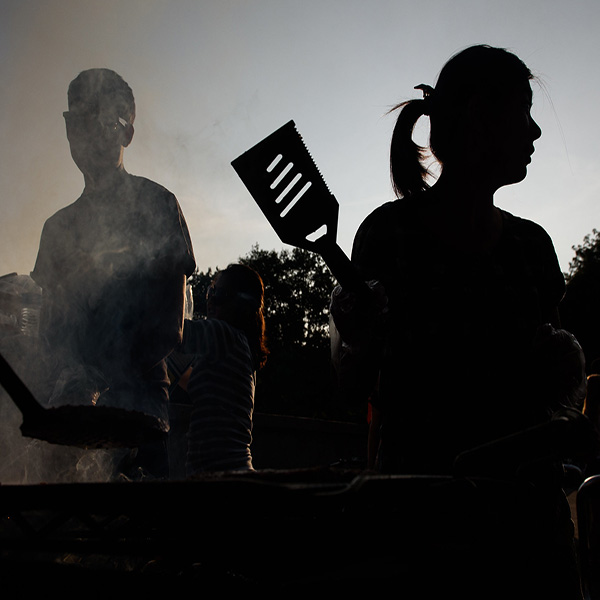 Girl grilling against the sunset