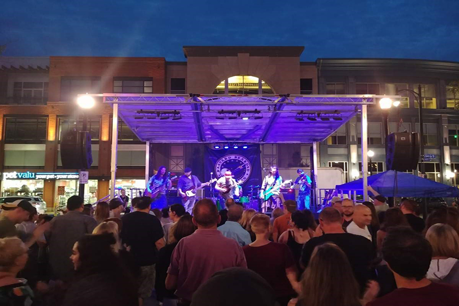 Band on stage with audience watching