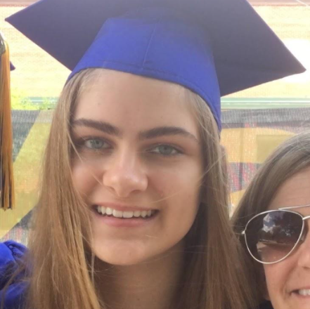 Katie Hart poses in a cap and gown.