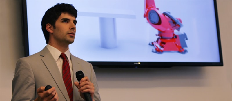 photo of student presenting on robotics