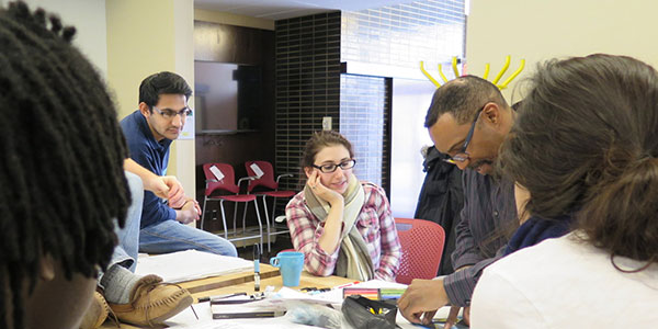 photo of students working with a professor